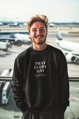 Pray Every Day Funny Unisex Sweatshirt worn by smiling man at airport.