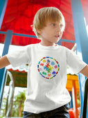 Child wearing Autism Awareness Kids Softstyle T-Shirt with colorful puzzle design.