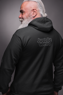 Dark full zip-up hoodie with "Just Be Weird" text, unlined hood, and pouch pockets.