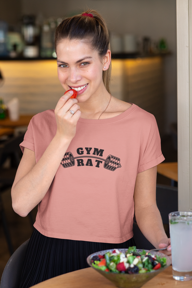 Women's cropped t-shirt with "Gym Rat" and barbell design, featuring flowy fit and modest crop.