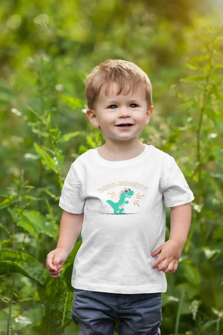 Toddler wearing Dino-Mighty Kids Softstyle T-Shirt in garden setting.