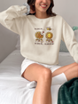 Unisex heavy blend sweatshirt with "He Loves Me...Not" design featuring sunflowers.