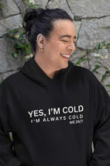 Unisex heavy blend hoodie with "Yes, I'm Cold" text in black, cozy and stylish for cold days.