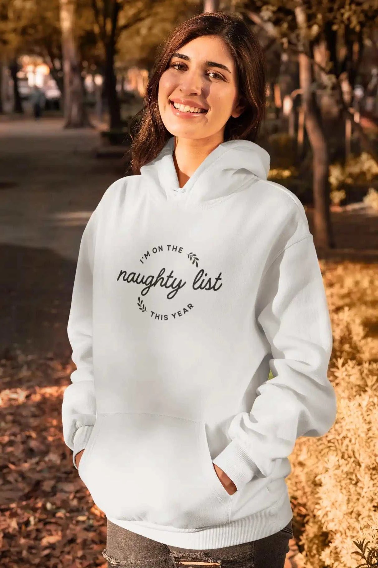 Naughty List Unisex Heavy Blend Hoodie with kangaroo pocket and drawstring, cozy cotton-polyester blend.