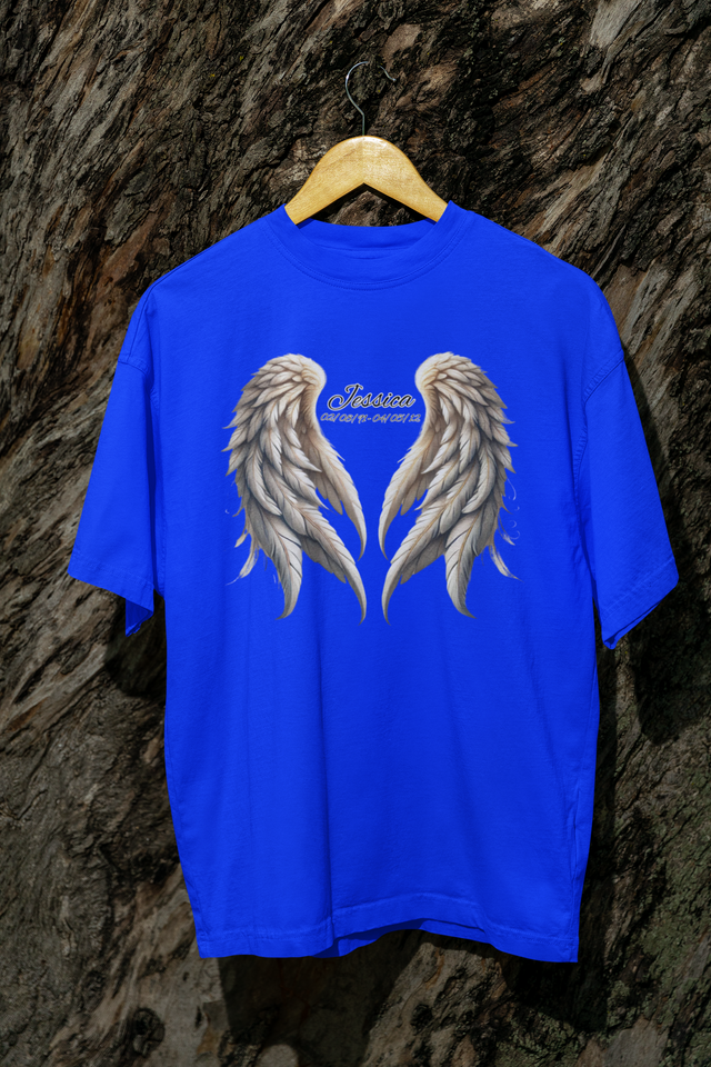 Jessica Angel Unisex Softstyle T-Shirt hanging on a wooden hanger with angel wing design.