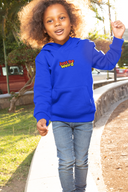 Kid wearing blue "Just Be Weird" hoodie outdoors, smiling and walking.