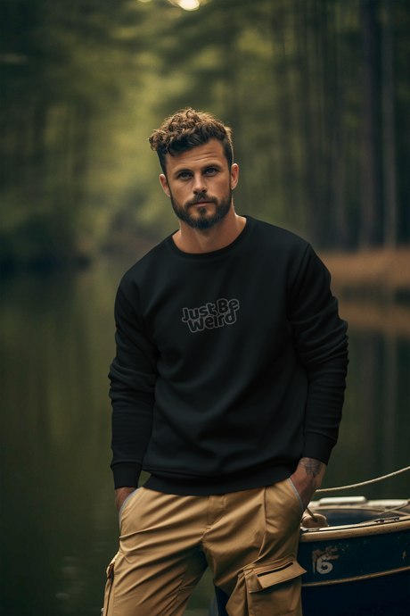 Just Be Weird Dark Unisex Heavy Blend Sweatshirt in a natural forest setting.