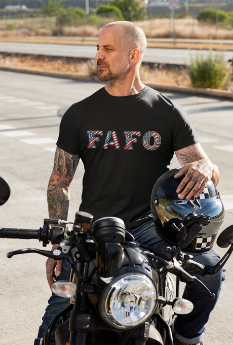 FAFO Patriotic Unisex Softstyle T-Shirt worn by man on motorcycle.