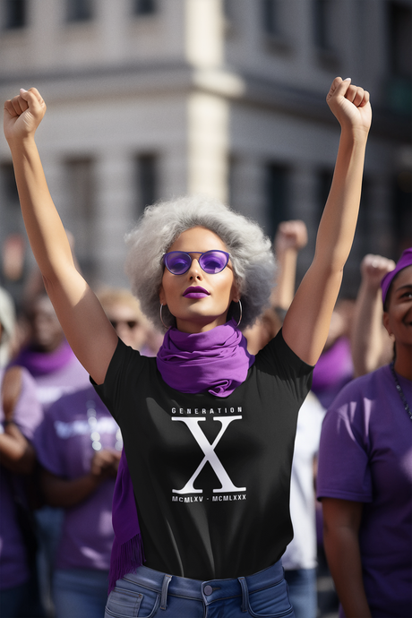 Generation X 1965 - 1980 Women's Softstyle T-Shirt with bold design, worn by a woman in a crowd, showcasing style and heritage.