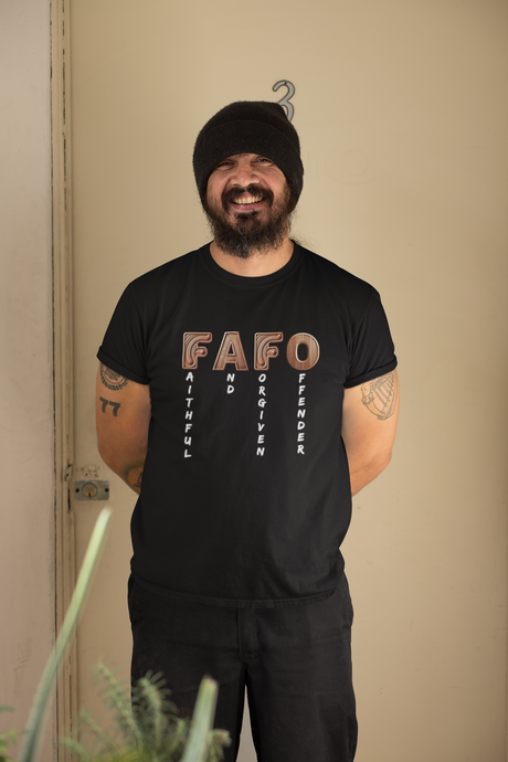 FAFO Religious Unisex Softstyle T-Shirt with bold lettering design, worn by a person.