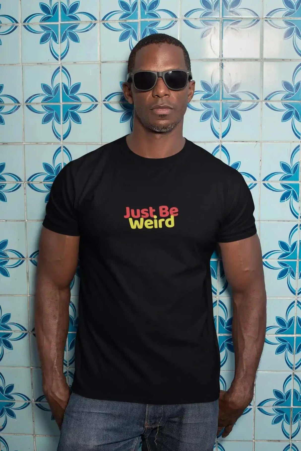 Just Be Weird unisex softstyle t-shirt with colorful text design.